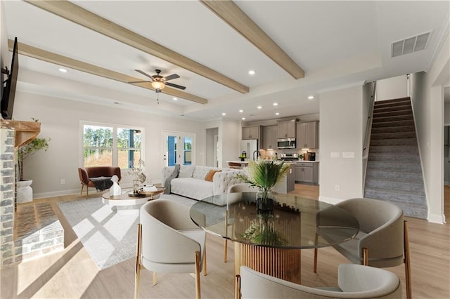 living area with visible vents, stairs, light wood-style floors, beam ceiling, and recessed lighting