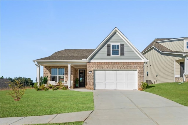 craftsman-style house with brick siding, driveway, central AC, and a front lawn