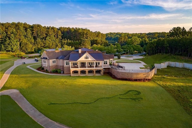 drone / aerial view featuring a view of trees