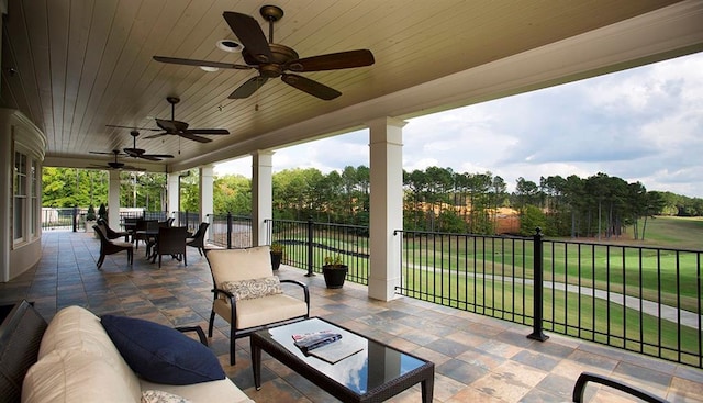 view of patio / terrace featuring ceiling fan, fence, outdoor lounge area, and outdoor dining space