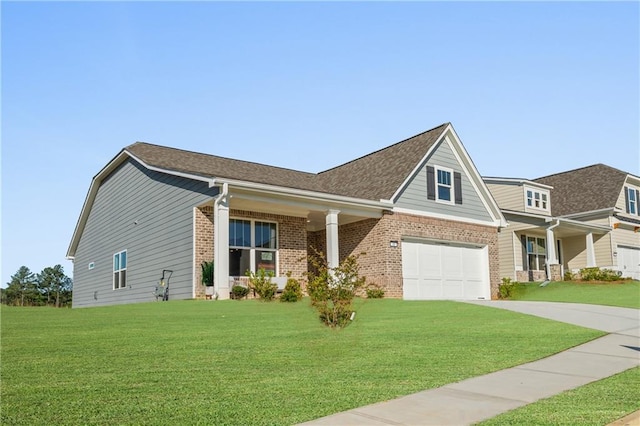 craftsman inspired home featuring brick siding, a shingled roof, concrete driveway, a garage, and a front lawn