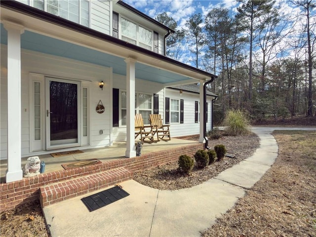 property entrance featuring covered porch