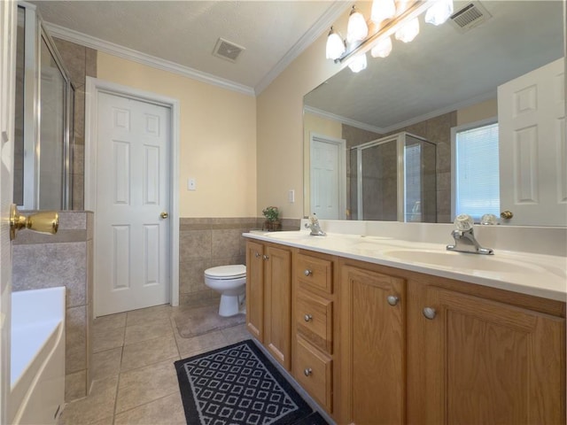 full bath with a stall shower, a sink, visible vents, and tile walls