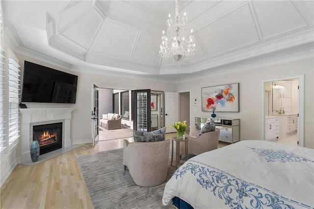 bedroom featuring ornamental molding, an inviting chandelier, and multiple windows
