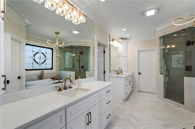 full bathroom featuring ornamental molding, a notable chandelier, and a sink