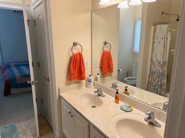 240 Huiet Dr, Mcdonough, GA 30252 - ensuite bathroom featuring double vanity and a shower with shower curtain