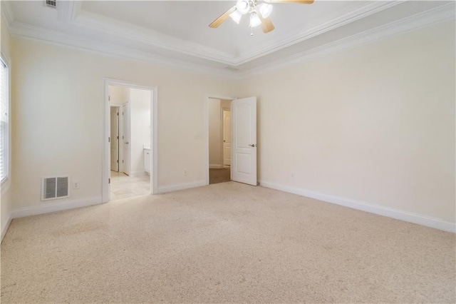 240 Huiet Dr, Mcdonough, GA 30252 - empty room featuring crown molding, carpet flooring, a ceiling fan, baseboards, and a raised ceiling
