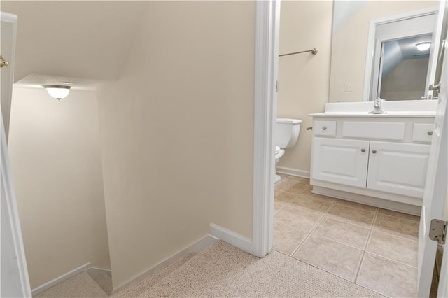 240 Huiet Dr, Mcdonough, GA 30252 - bathroom featuring toilet, vanity, baseboards, and tile patterned floors