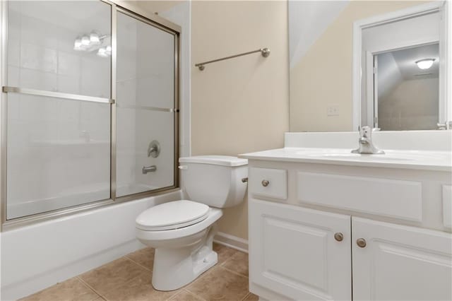 240 Huiet Dr, Mcdonough, GA 30252 - bathroom featuring tile patterned flooring, toilet, vanity, and bath / shower combo with glass door