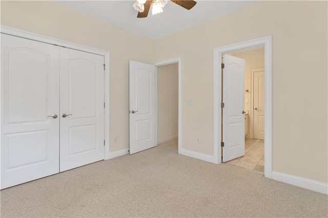 240 Huiet Dr, Mcdonough, GA 30252 - unfurnished bedroom with light colored carpet, baseboards, a closet, and a ceiling fan