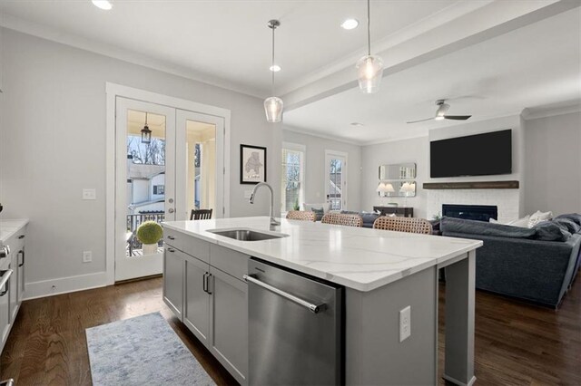 2005 Haley Walk, Woodstock, GA 30188 - kitchen featuring dishwasher, a sink, a glass covered fireplace, dark wood-style flooring, and ceiling fan
