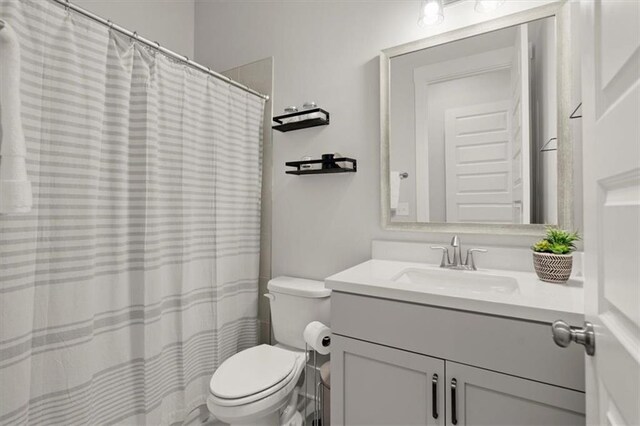 2005 Haley Walk, Woodstock, GA 30188 - bathroom featuring vanity, toilet, and a shower with curtain