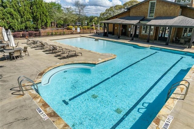 2005 Haley Walk, Woodstock, GA 30188 - community pool featuring a patio area
