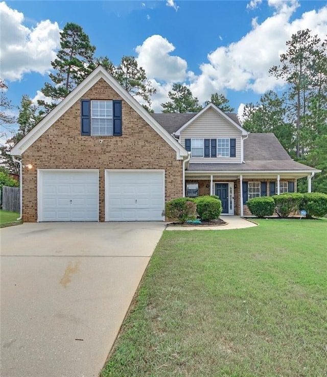 traditional home featuring a front lawn, concrete driveway, and brick siding