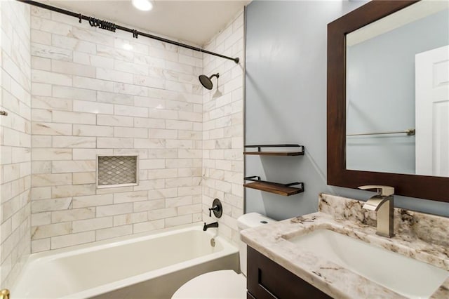 bathroom with vanity, toilet, and bathing tub / shower combination