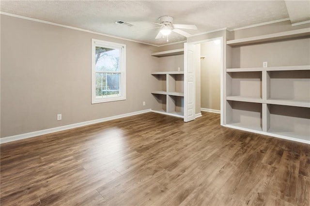 unfurnished bedroom with ornamental molding, wood finished floors, visible vents, and a textured ceiling