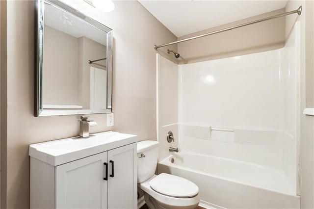 bathroom with vanity, toilet, and shower / washtub combination