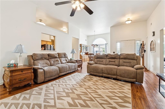 5102 Yellow Stone Dr, Flowery Branch, GA 30542 - living area with a ceiling fan, a towering ceiling, wood finished floors, and a chandelier