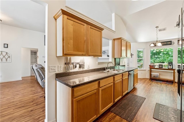 5102 Yellow Stone Dr, Flowery Branch, GA 30542 - kitchen featuring a sink, light wood-type flooring, dark countertops, dishwasher, and lofted ceiling