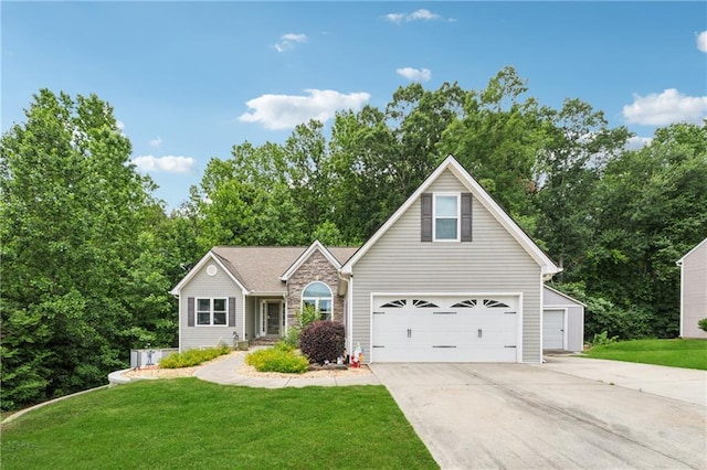 5102 Yellow Stone Dr, Flowery Branch, GA 30542 - traditional-style home featuring concrete driveway, stone siding, and a front yard