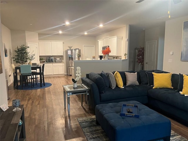 living room with hardwood / wood-style floors and ceiling fan