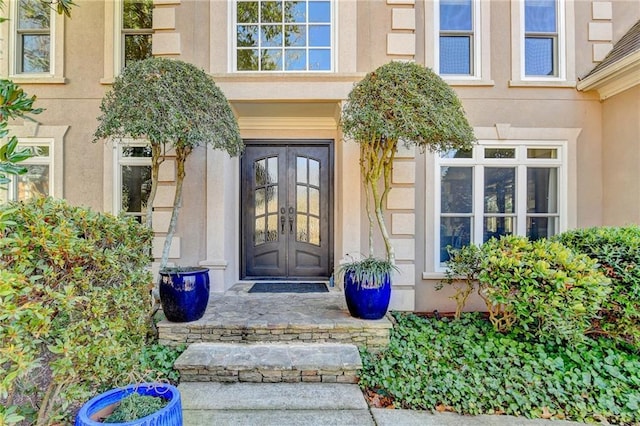 entrance to property featuring french doors