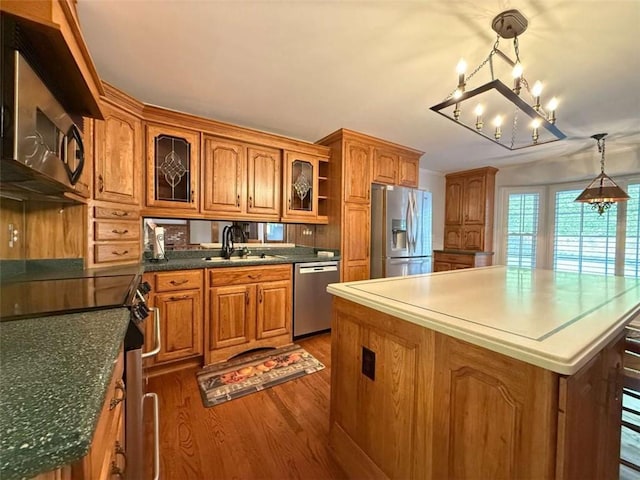 8710 Mount Rushmore Dr, Johns Creek, GA 30022 - kitchen with stainless steel appliances, a sink, brown cabinetry, and open shelves