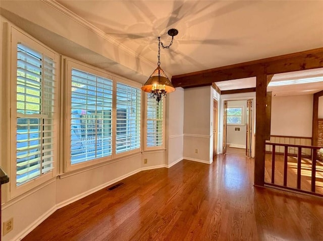 8710 Mount Rushmore Dr, Johns Creek, GA 30022 - unfurnished dining area with a chandelier, wood finished floors, baseboards, and crown molding