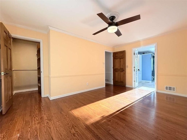 8710 Mount Rushmore Dr, Johns Creek, GA 30022 - unfurnished bedroom featuring ornamental molding, wood finished floors, baseboards, and a ceiling fan