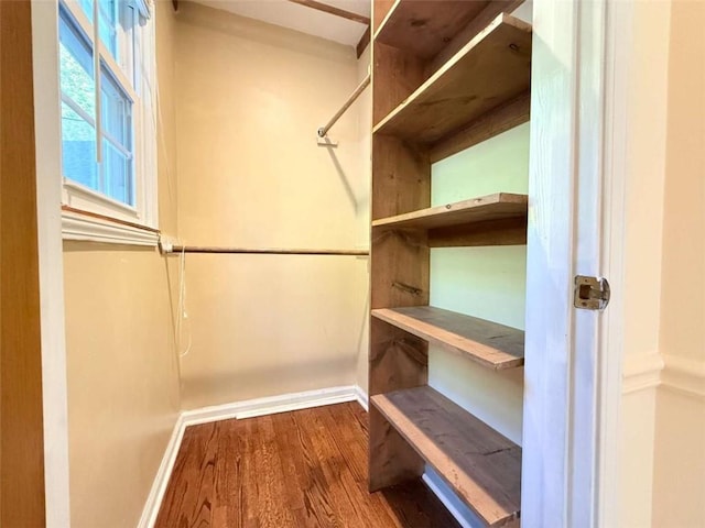 8710 Mount Rushmore Dr, Johns Creek, GA 30022 - walk in closet featuring wood finished floors