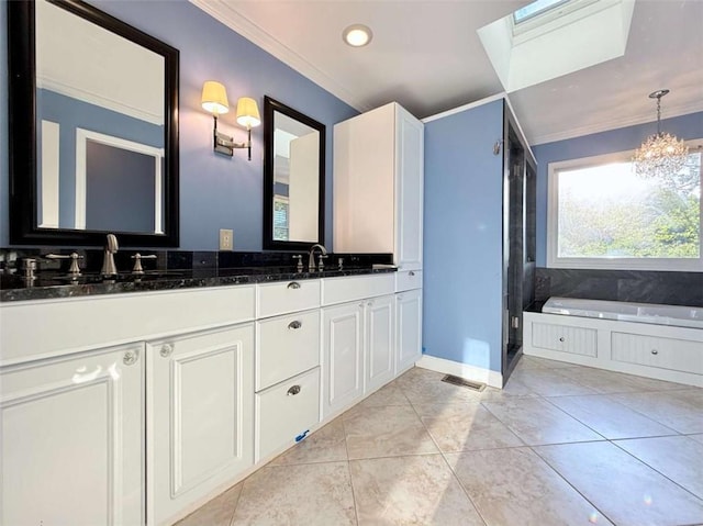 8710 Mount Rushmore Dr, Johns Creek, GA 30022 - bathroom with ornamental molding, double vanity, a garden tub, a chandelier, and a shower stall