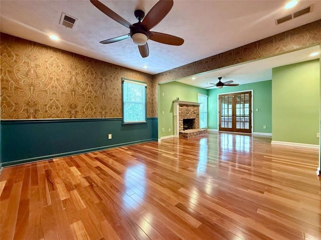 8710 Mount Rushmore Dr, Johns Creek, GA 30022 - unfurnished living room featuring wallpapered walls, a ceiling fan, baseboards, healthy amount of natural light, and recessed lighting