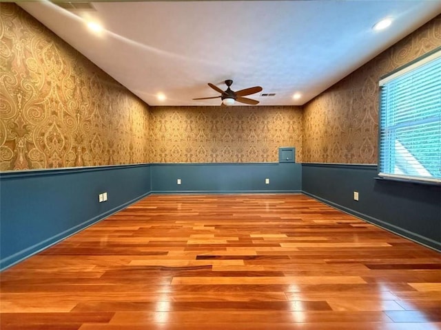 8710 Mount Rushmore Dr, Johns Creek, GA 30022 - spare room featuring wood finished floors, a ceiling fan, wallpapered walls, baseboards, and recessed lighting