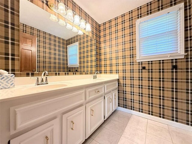 8710 Mount Rushmore Dr, Johns Creek, GA 30022 - bathroom with wallpapered walls, double vanity, tile patterned floors, and plenty of natural light