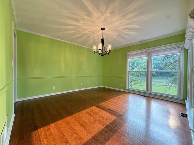 8710 Mount Rushmore Dr, Johns Creek, GA 30022 - empty room featuring a chandelier, wood finished floors, ornamental molding, and baseboards
