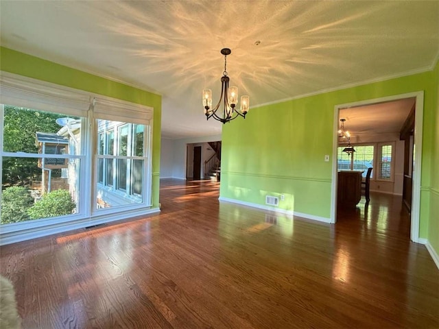8710 Mount Rushmore Dr, Johns Creek, GA 30022 - unfurnished dining area featuring a chandelier, wood finished floors, baseboards, and ornamental molding