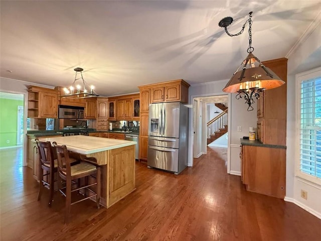 8710 Mount Rushmore Dr, Johns Creek, GA 30022 - kitchen featuring appliances with stainless steel finishes, a chandelier, open shelves, brown cabinetry, and ornamental molding