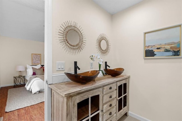 35 Lady Morgan Ln, Dallas, GA 30157 - full bathroom featuring wood finished floors, double vanity, and baseboards