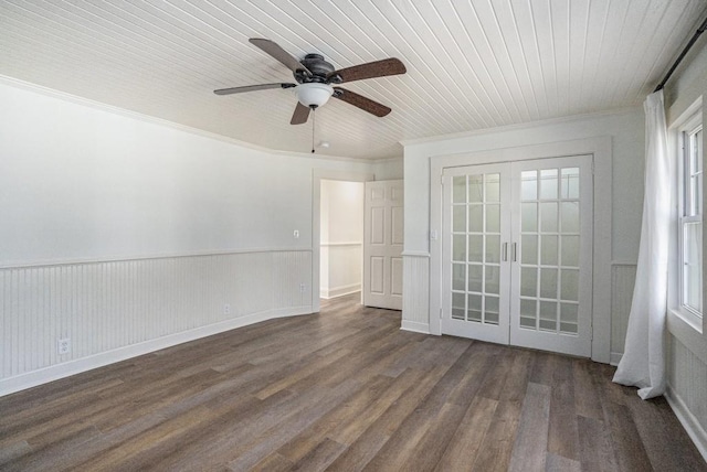 empty room featuring french doors, crown molding, ceiling fan, dark hardwood / wood-style flooring, and wood ceiling