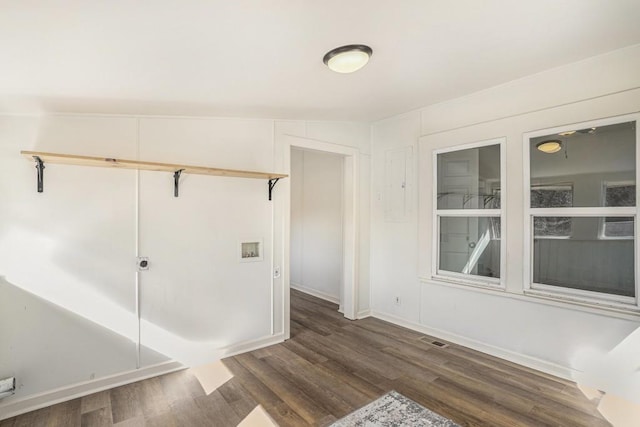 spare room featuring dark hardwood / wood-style floors