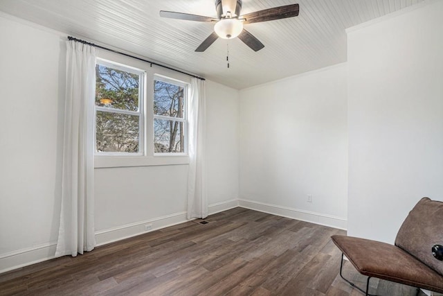 unfurnished room with ceiling fan and dark wood-type flooring