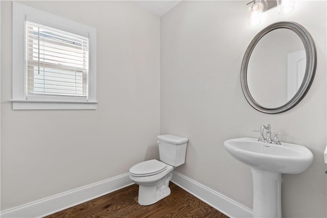 bathroom featuring toilet and hardwood / wood-style floors