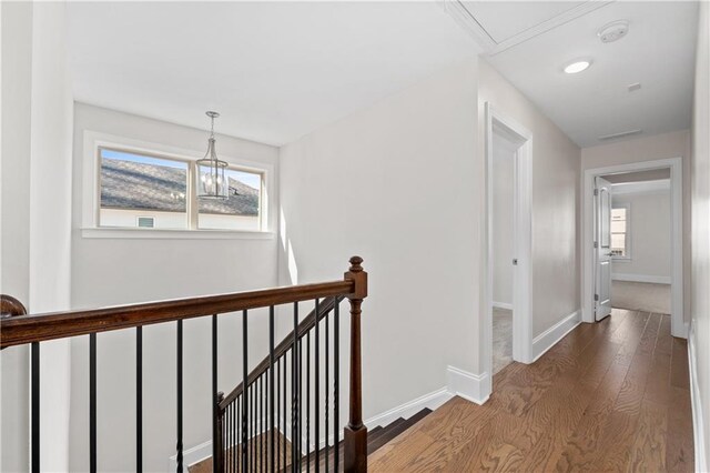 hall with wood-type flooring