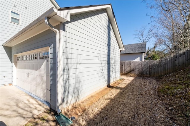 view of side of property featuring a garage