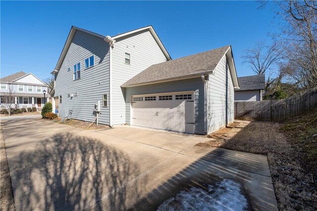 view of property exterior featuring a garage