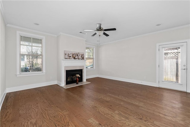 unfurnished living room featuring ceiling fan, dark hardwood / wood-style flooring, and crown molding