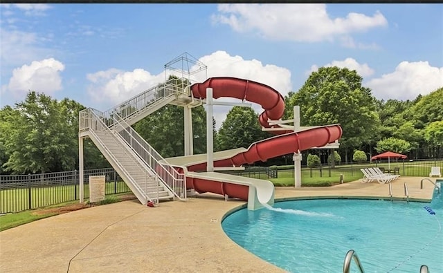 view of pool with a water slide