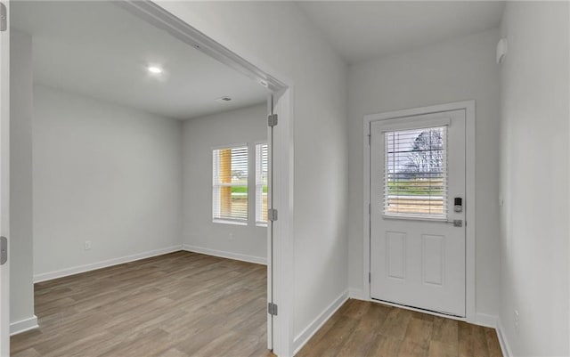 entryway with light hardwood / wood-style flooring