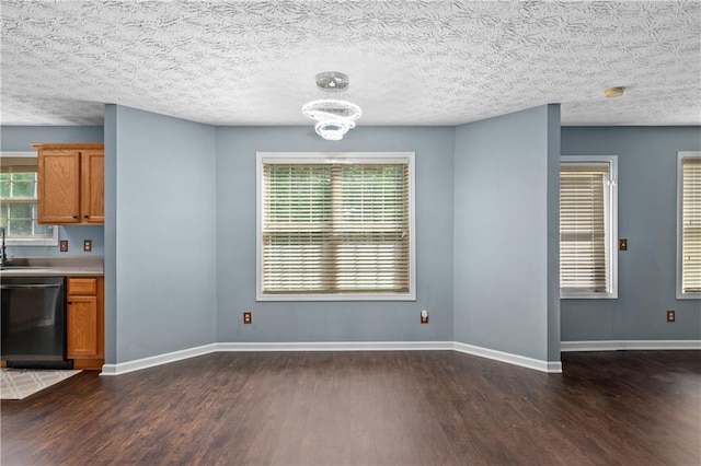 152 Maxton Ave, Dallas, GA 30132 - unfurnished dining area with wood finished floors, a chandelier, a sink, and baseboards