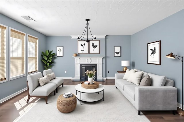 152 Maxton Ave, Dallas, GA 30132 - living area with wood finished floors, a glass covered fireplace, and baseboards
